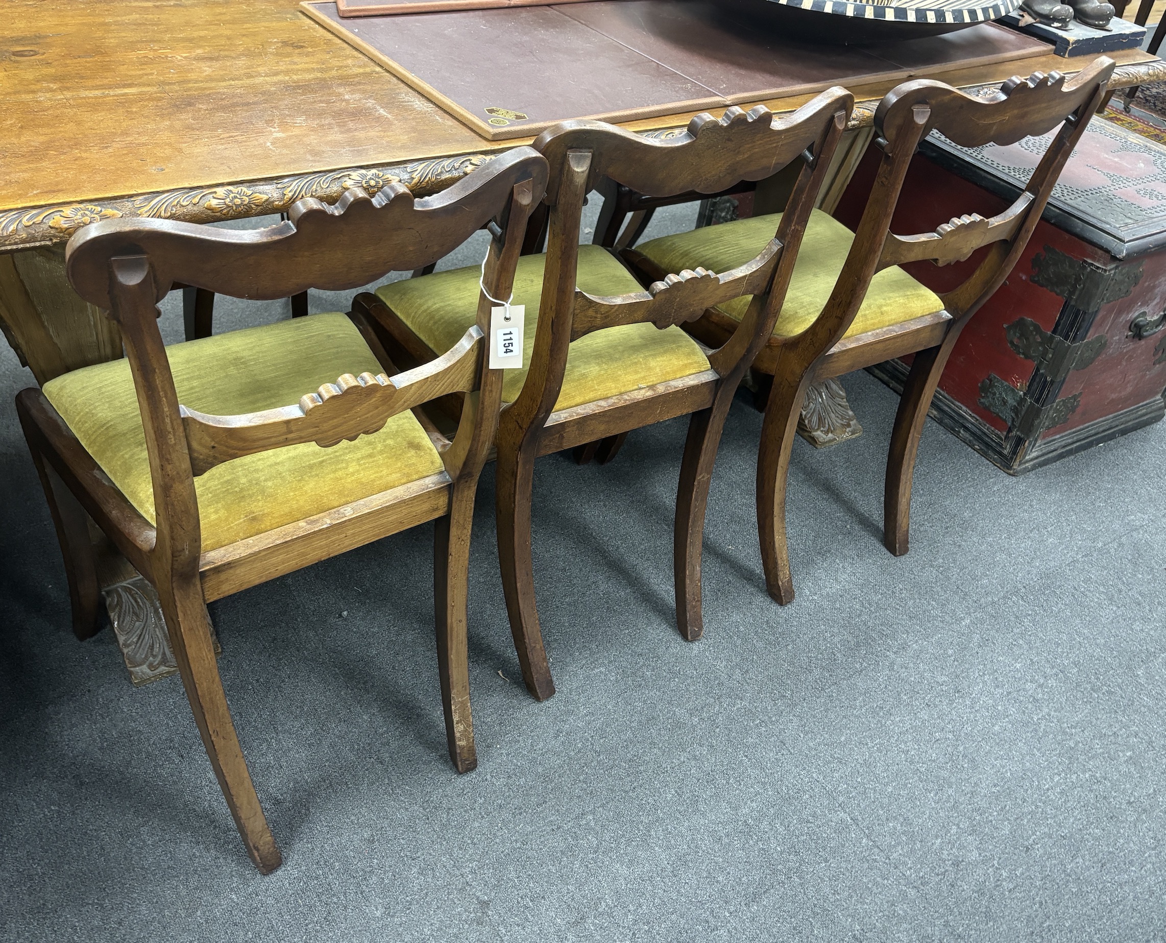 A set of six Regency mahogany sabre leg dining chairs